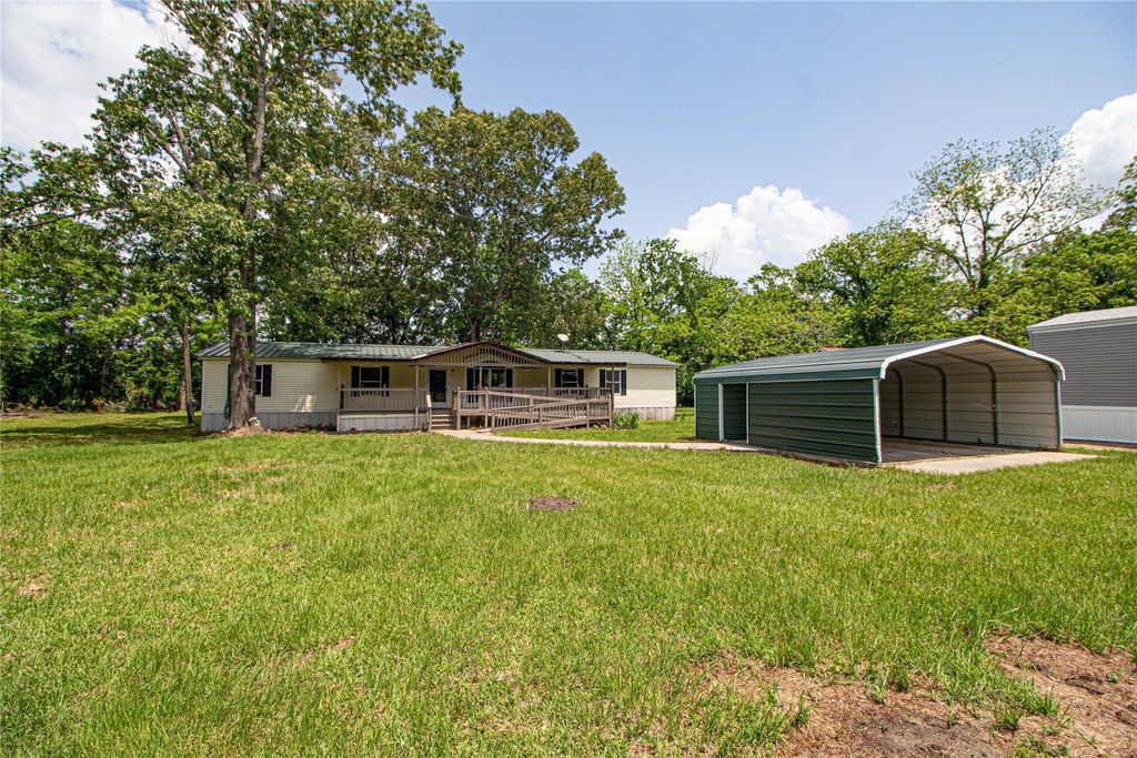 Photo of 613 River Road, Goodrich, TX 77335 (MLS # 84552130)
