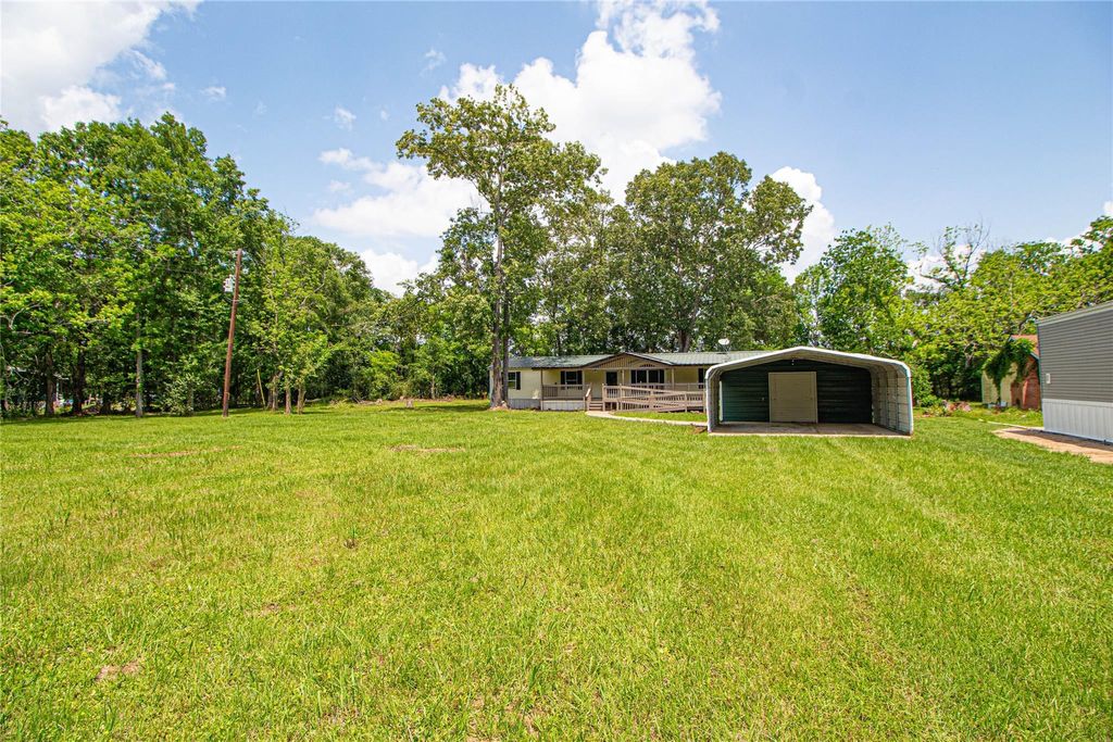 Photo of 613 River Road, Goodrich, TX 77335 (MLS # 84552130)