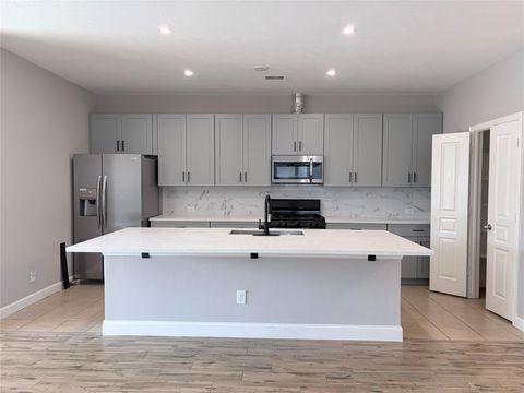 Photo of 10910 Woodwind Shadows Drive, Cypress, TX 77433 (MLS # 77219057)