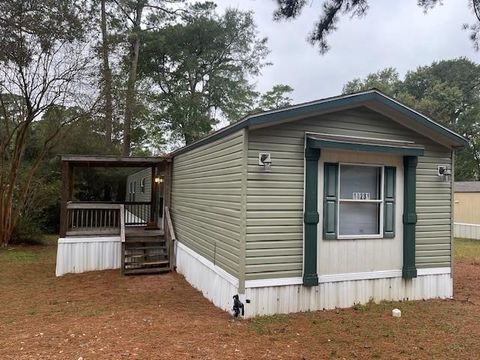 Photo of 14231 E Ravine Run, Willis, TX 77318 (MLS # 85239368)