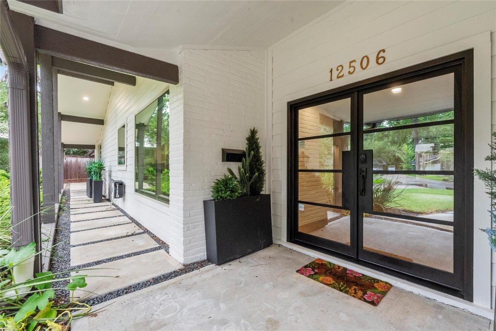 Photo of 12506 Winding Brook Lane, Houston, TX 77024 (MLS # 42233848)