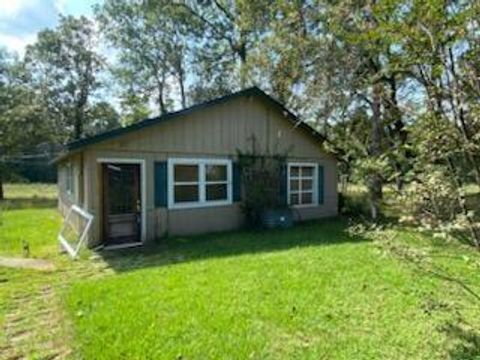 Photo of 6 Post Oak Dr, Huntsville, TX 77320 (MLS # 15950835)