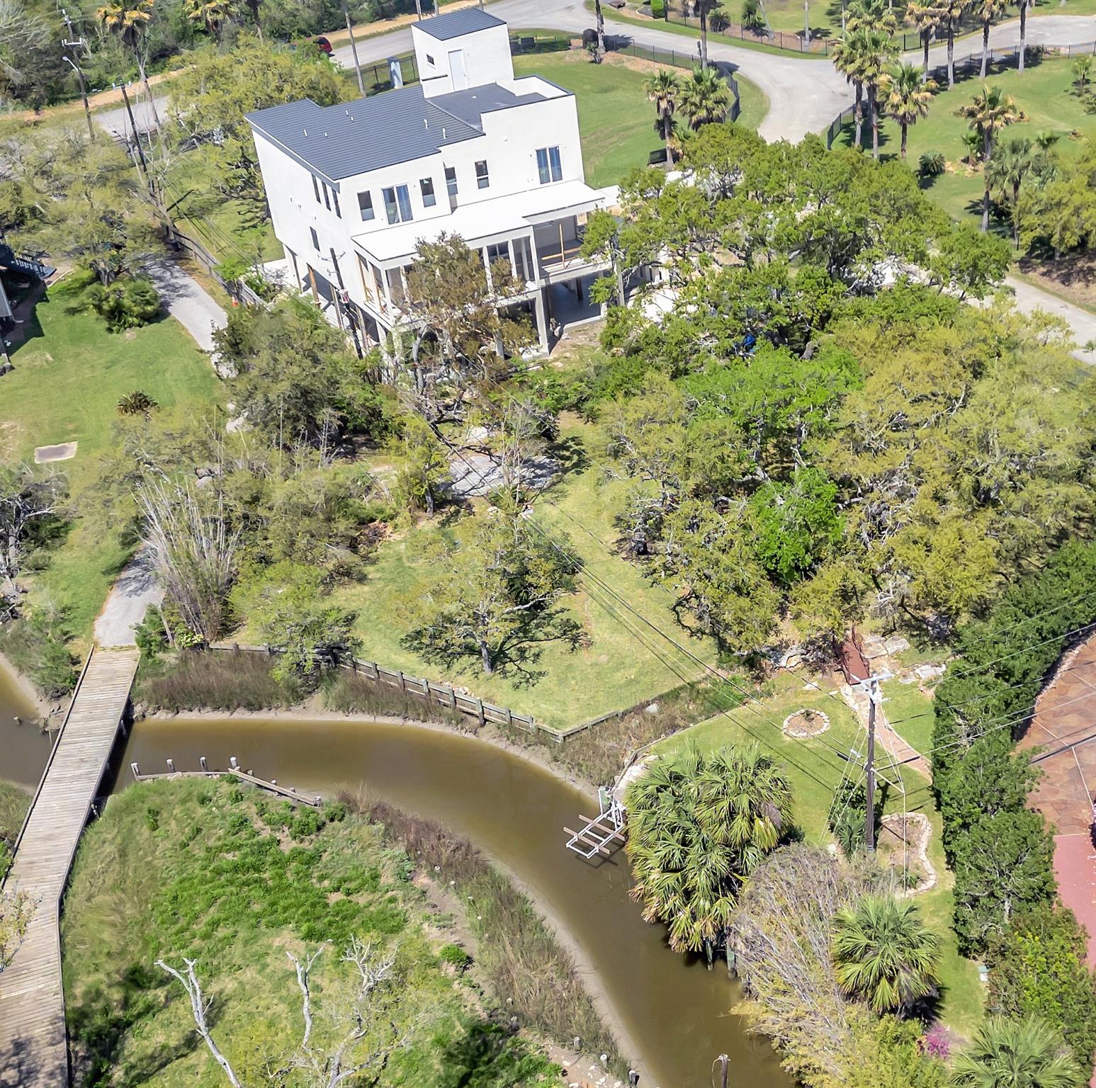 Aerial view showcasing the property's mature landscape.