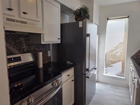 Photo of 10075 Westpark Drive #40, Houston, TX 77042 (MLS # 70268332)
