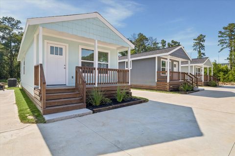 Photo of 22837 E Community Drive, New Caney, TX 77357 (MLS # 90170346)