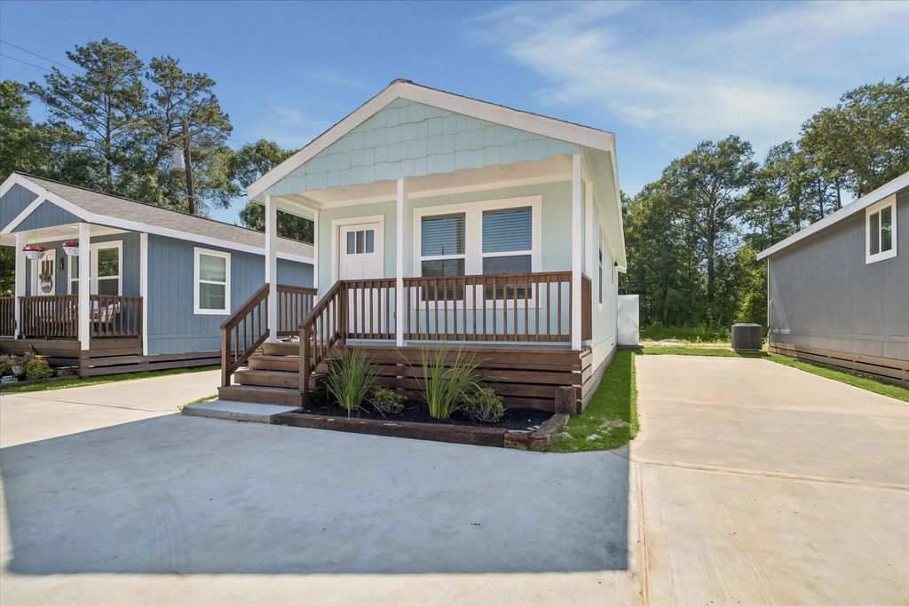 Photo of 22837 E Community Drive, New Caney, TX 77357 (MLS # 90170346)