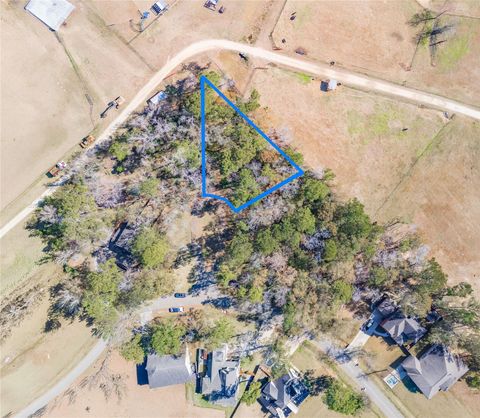 Photo of 24 Holly Springs Dr, Conroe, TX 77302 (MLS # 67489287)