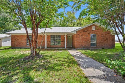 Photo of 100 Bybee Street, Willis, TX 77378 (MLS # 32375970)