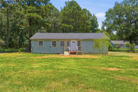 Photo of 700 Butler Drive, Cleveland, TX 77328 (MLS # 67513516)
