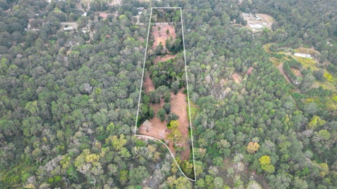 Photo of 5 Metts, Conroe, TX 77306 (MLS # 92047106)