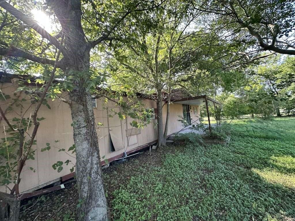 Photo of 602 E Navasota Street, Groesbeck, TX 76642 (MLS # 71120022)