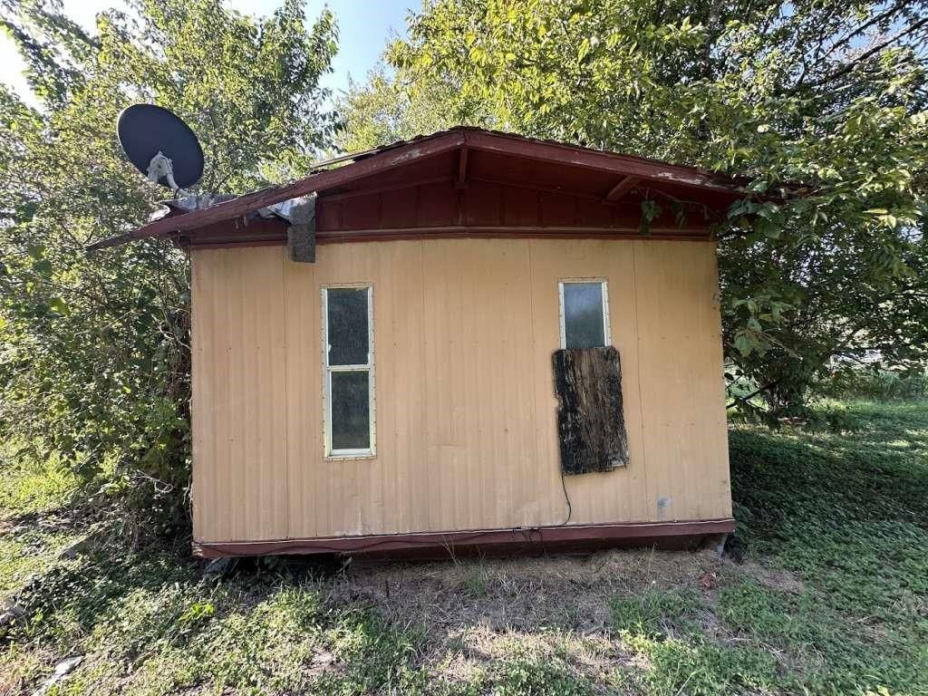 Photo of 602 E Navasota Street, Groesbeck, TX 76642 (MLS # 71120022)