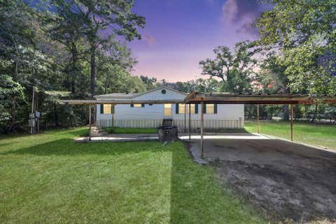 Photo of 14009 Rustic Lane Ln, Conroe, TX 77306 (MLS # 24000098)