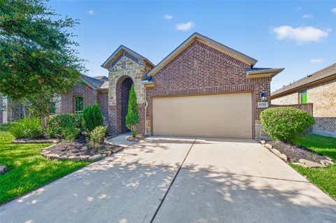 Photo of 9718 Justin Ridge Lane, Humble, TX 77396 (MLS # 62858576)