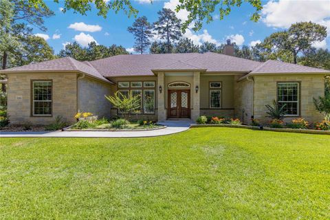 Photo of 166 Rim Rock Road, Huntsville, TX 77340 (MLS # 83381242)