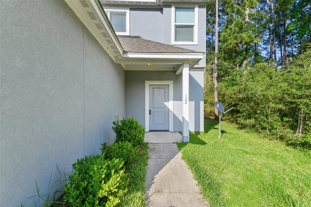 Photo of 124 Artesian Way, New Caney, TX 77357 (MLS # 98758338)