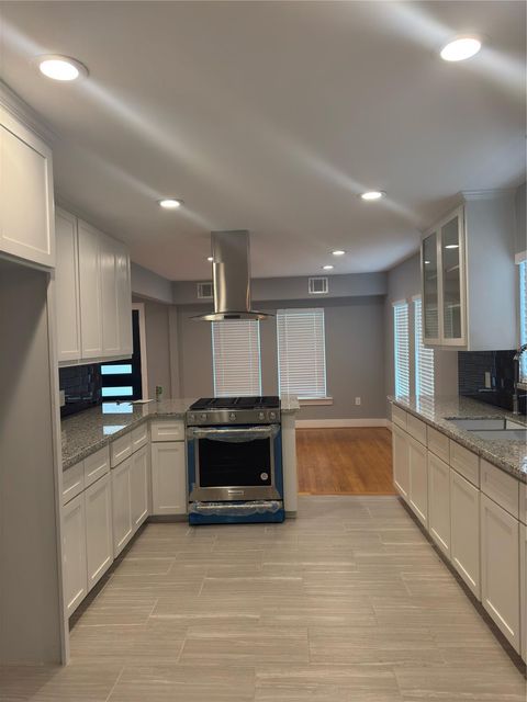 Photo of 515 Caplin Street, Houston, TX 77022 (MLS # 94347618)