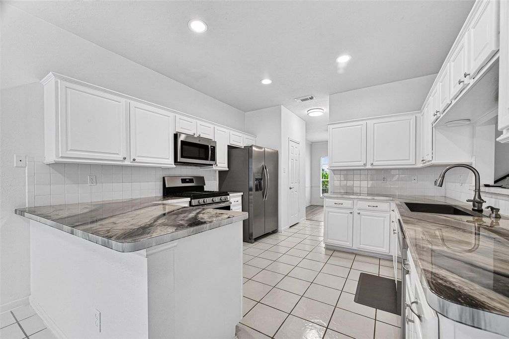 Photo of 1253 El Camino Village Drive, Webster, TX 77058 (MLS # 32890897)