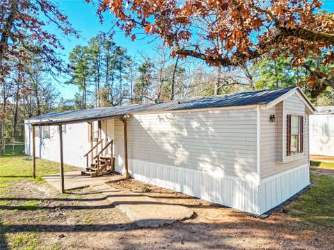 Photo of 1202 Us Highway 190 E Unit 17, Huntsville, TX 77320 (MLS # 71228665)