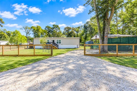 Photo of 225 County Road 3294, Cleveland, TX 77327 (MLS # 2172996)