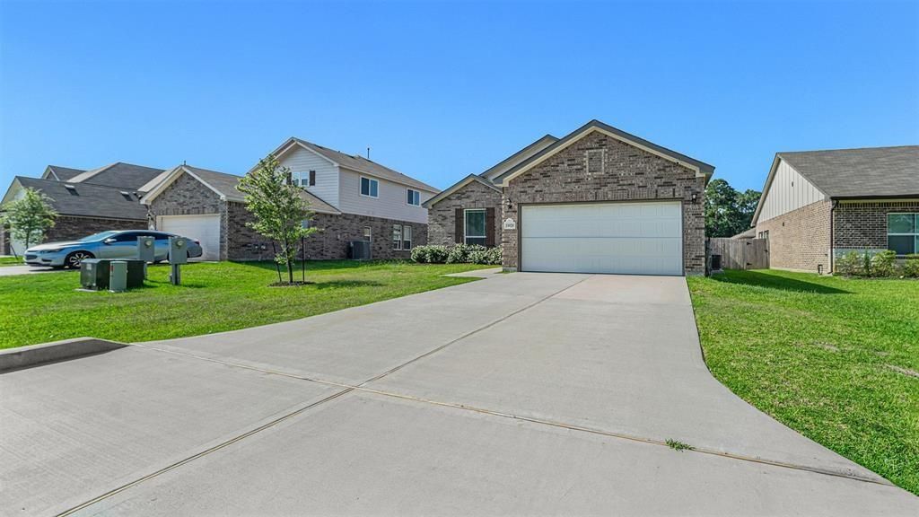 Photo of 15020 Meadow Glen N, Conroe, TX 77306 (MLS # 61155502)