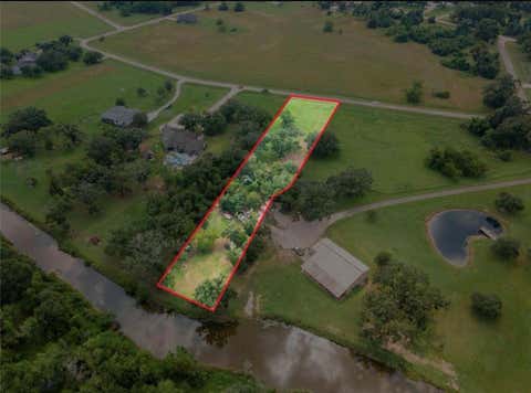Photo of TBD Wrangler Bend, Angleton, TX 77515 (MLS # 68823932)