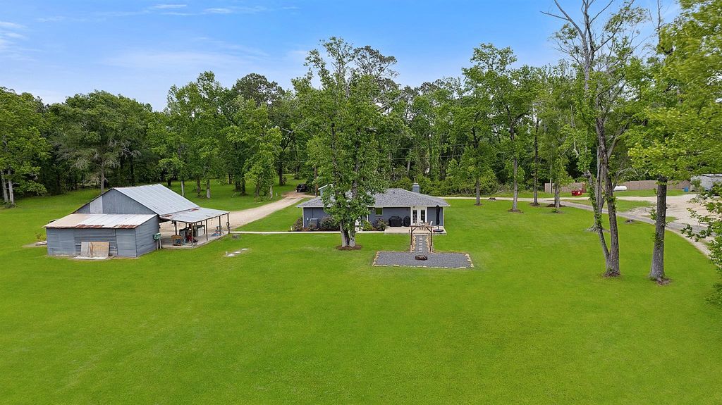 Photo of 10792 Stidham Road, Conroe, TX 77302 (MLS # 87403230)