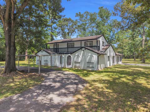 Photo of 33102 Rollingwood Drive, Pinehurst, TX 77362 (MLS # 74819626)