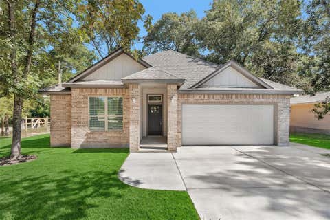 Photo of 11101 Park Dr Dr, Willis, TX 77378 (MLS # 7791082)