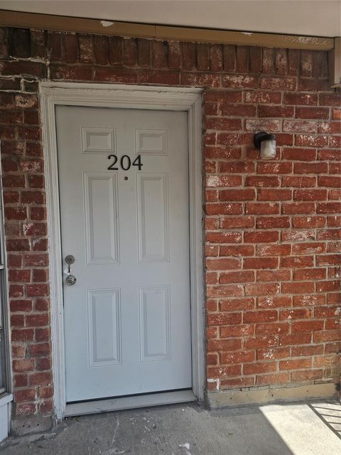 Photo of 9201 Clarewood Drive #204, Houston, TX 77036 (MLS # 12592749)