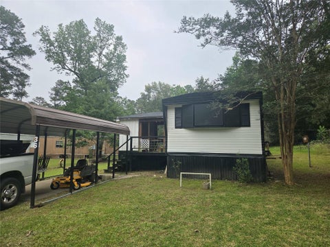 Photo of 36 E Whippoorwill Lane, Trinity, TX 75862 (MLS # 64305373)