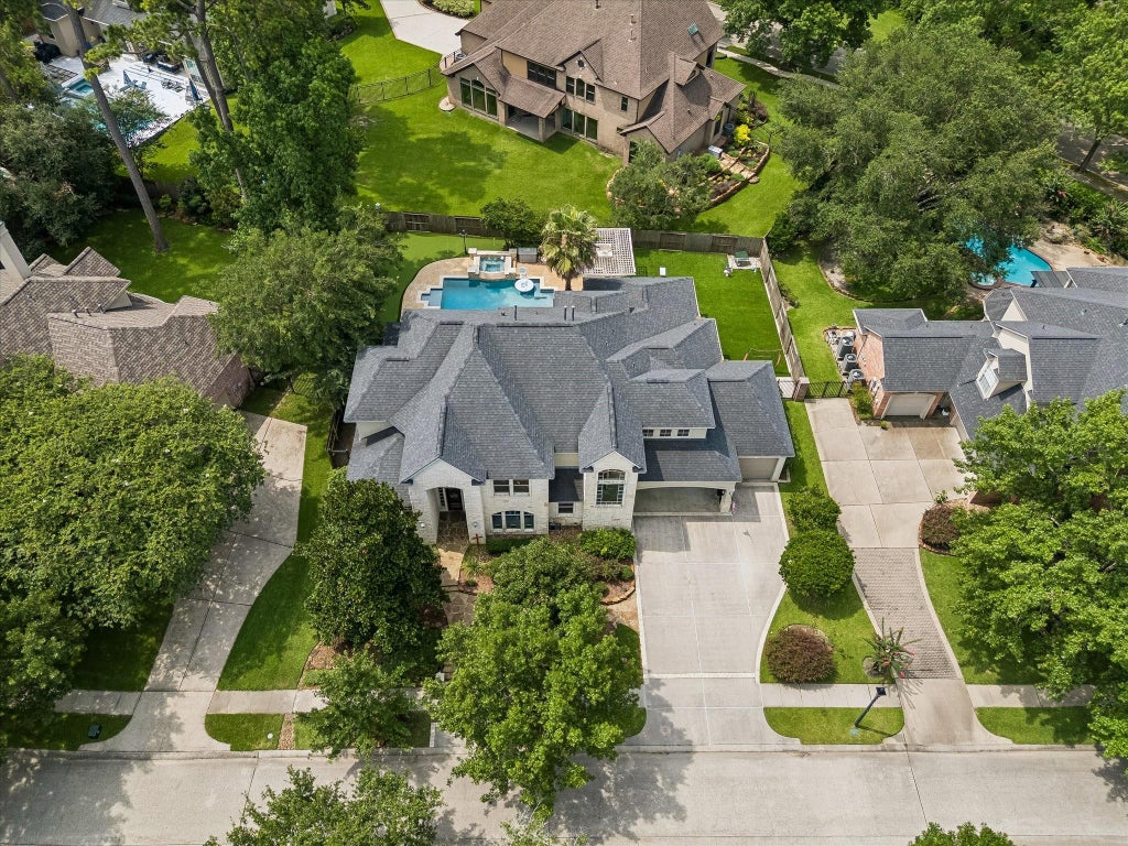 Photo of 25 Club Oak Court, Kingwood, TX 77339 (MLS # 74438049)