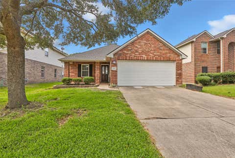 Photo of 10331 Whisper Bluff Drive, Humble, TX 77396 (MLS # 42992309)