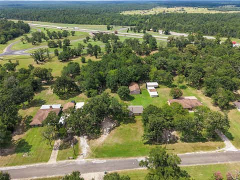 Photo of 21 Wood Lodge Drive, Huntsville, TX 77320 (MLS # 24714160)