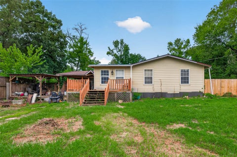Photo of 141 Town And Country Drive, Huntsville, TX 77320 (MLS # 51803345)