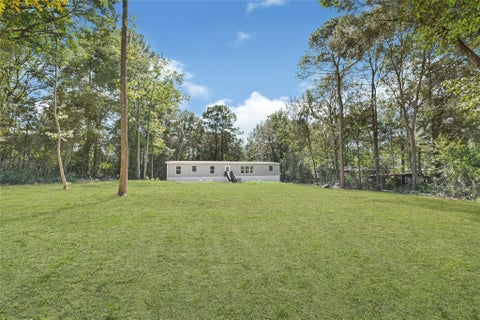 Photo of 10506 Settlers Crossing, Conroe, TX 77303 (MLS # 48853527)