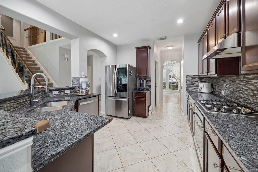 Photo of 14419 Baron Creek Lane, Houston, TX 77044 (MLS # 34747759)