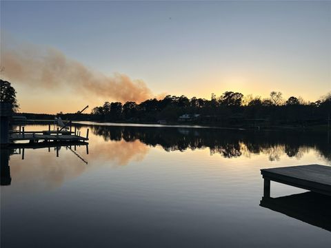 Photo of 1 Sunset Lake, Huntsville, TX 77340 (MLS # 59254348)