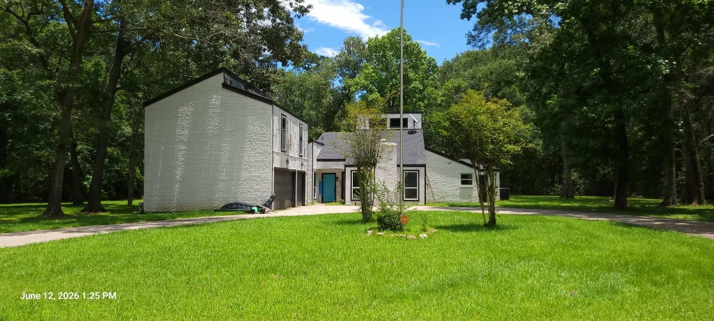 Photo of 854 Fairway Drive, New Caney, TX 77357 (MLS # 79286290)