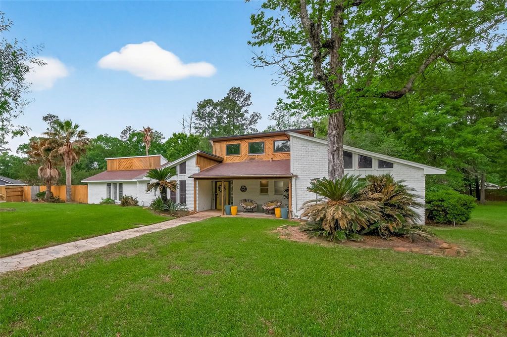 Photo of 2411 Roman Forest Boulevard, New Caney, TX 77357 (MLS # 53027354)