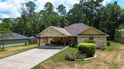 Photo of 10910 Royal Magnolia Drive, Conroe, TX 77303 (MLS # 95078007)