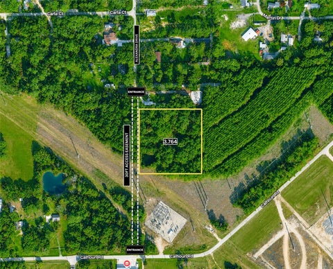 Photo of TBD Calhoun Road, Conroe, TX 77302 (MLS # 77350938)