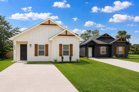 Photo of 313 N Woodson Street St, Willis, TX 77378 (MLS # 77488125)
