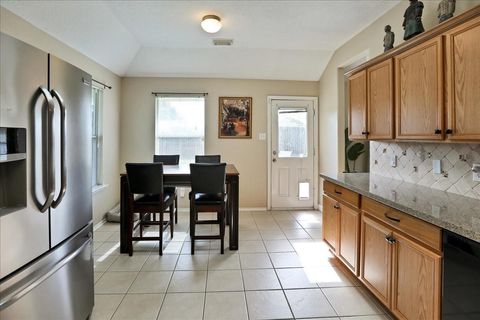 Photo of 14306 W Alaman Drive, Houston, TX 77090 (MLS # 21556453)