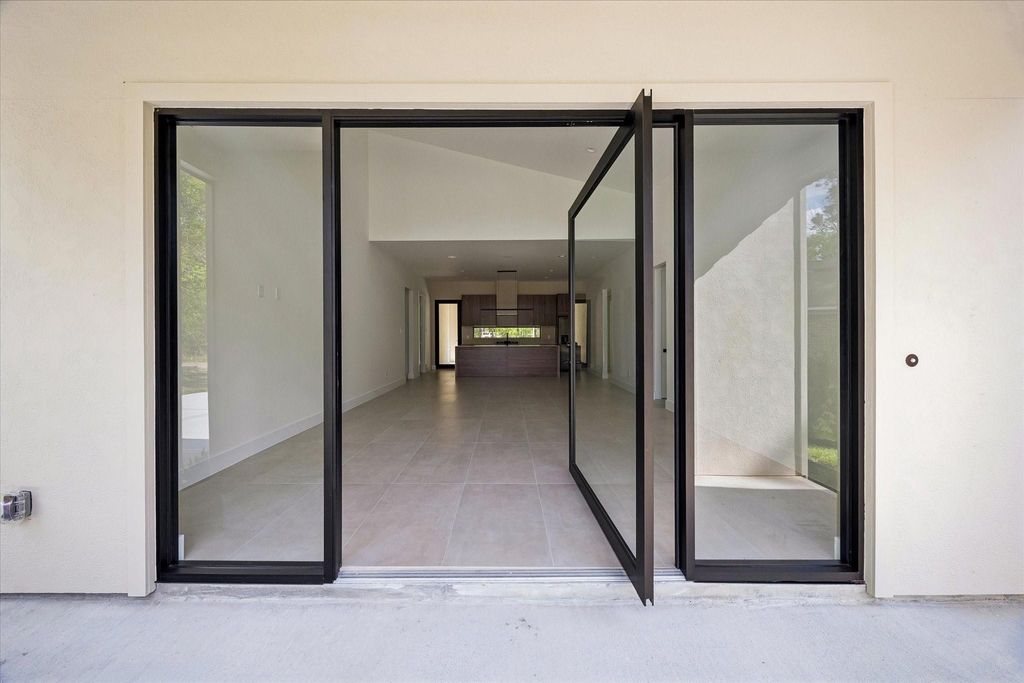 Photo of 10943 Mockingbird Place Pl, Conroe, TX 77385 (MLS # 58685266)