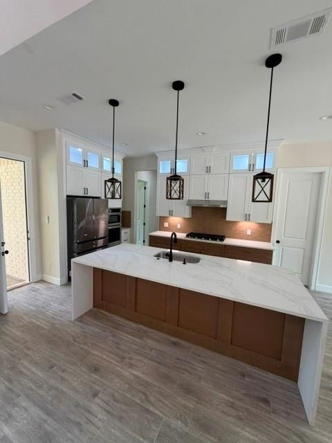 Photo of 114 Magnolia Bend Bnd, Roman Forest, TX 77357 (MLS # 70647413)