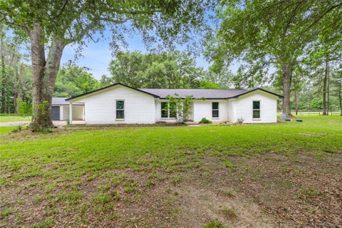 Photo of 74 Robinson Road, Huntsville, TX 77320 (MLS # 90856405)