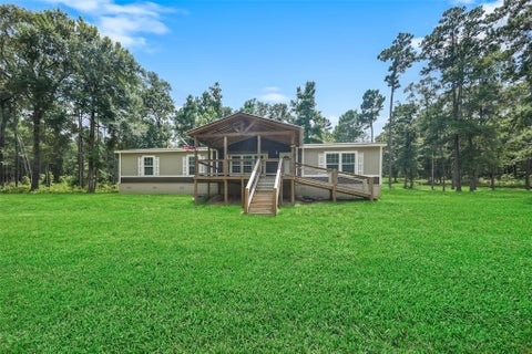 Photo of 577 Winding River Road, Oakhurst, TX 77364 (MLS # 78231122)