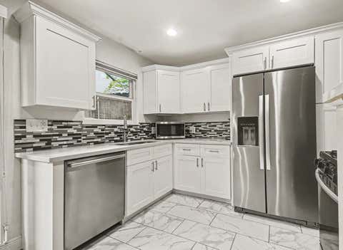 Photo of 4020 Blue Bonnet Boulevard #K, Houston, TX 77025 (MLS # 94248193)