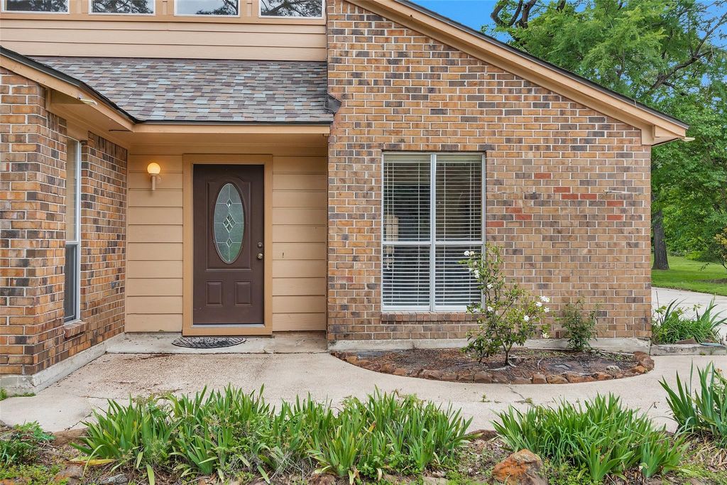 Photo of 12011 Maverick Drive, Willis, TX 77378 (MLS # 22030356)